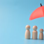 Chess pawns under umbrella